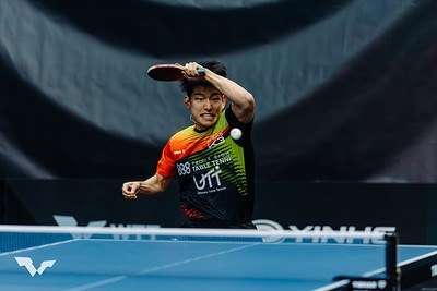 Kim Taehyun playing a forehand at the table